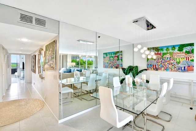 dining space with light tile patterned floors