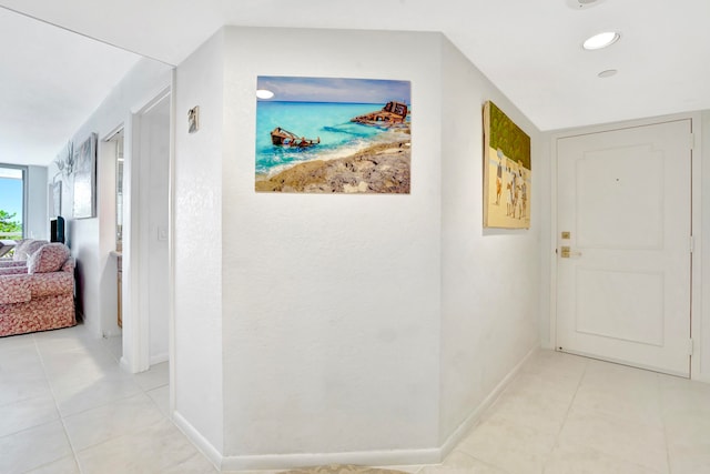 hallway with light tile patterned floors