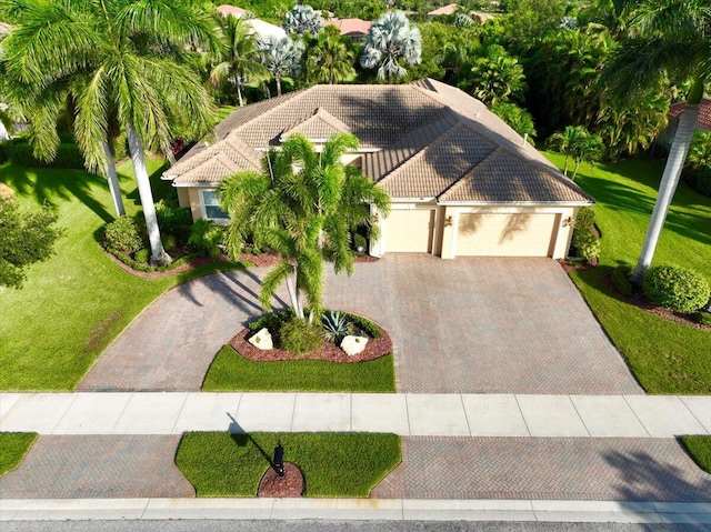 view of front facade with a front lawn and a garage