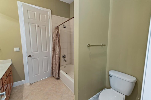 full bathroom with shower / bath combination with curtain, vanity, tile patterned floors, and toilet