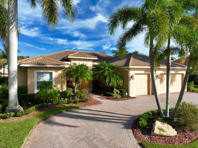 mediterranean / spanish-style home featuring a garage