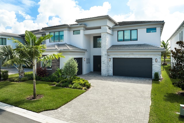 prairie-style house with a front yard and a garage