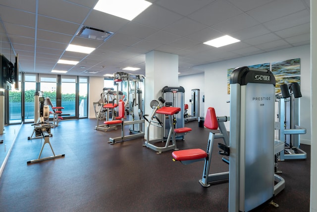 exercise room featuring a paneled ceiling