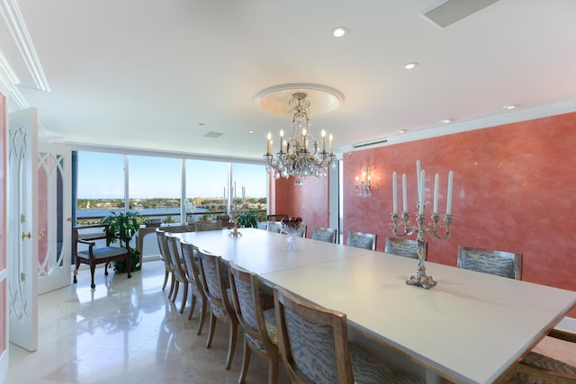 dining room with ornamental molding, a chandelier, and floor to ceiling windows