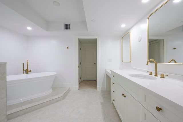 bathroom featuring vanity and a tub to relax in