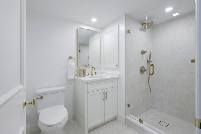 bathroom featuring vanity, toilet, and walk in shower