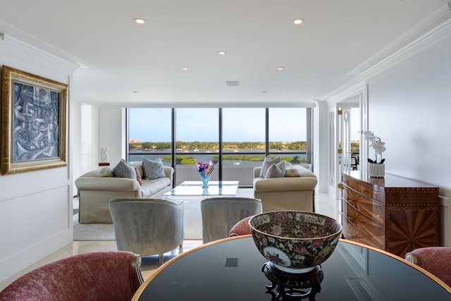 tiled living room with crown molding, a healthy amount of sunlight, and a wall of windows