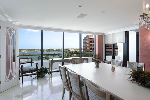 dining room with floor to ceiling windows, ornamental molding, a water view, and light tile patterned floors