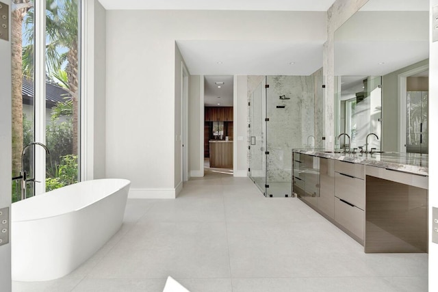 bathroom featuring separate shower and tub, tile patterned floors, and vanity