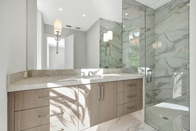 bathroom with vanity and an enclosed shower