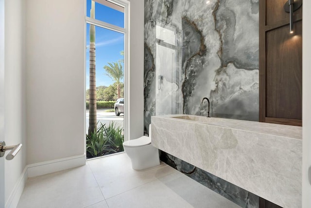 bathroom featuring tile patterned floors and toilet