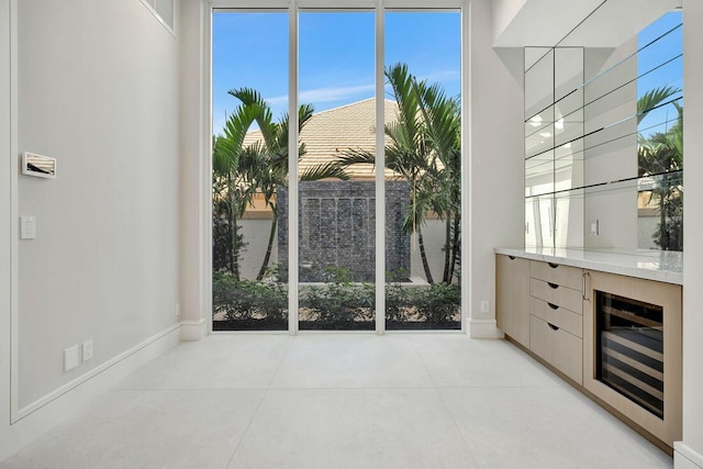 interior space with a healthy amount of sunlight and beverage cooler