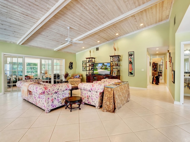 living room featuring ceiling fan, light tile floors, beam ceiling, a towering ceiling, and wood ceiling