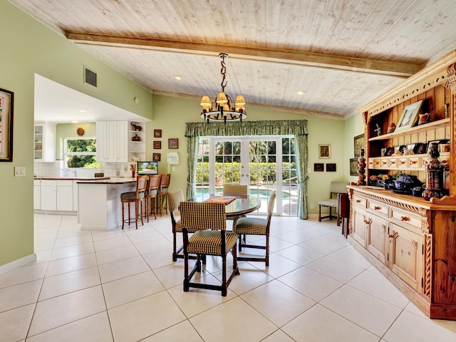 tiled dining area with a notable chandelier, plenty of natural light, french doors, and wooden ceiling