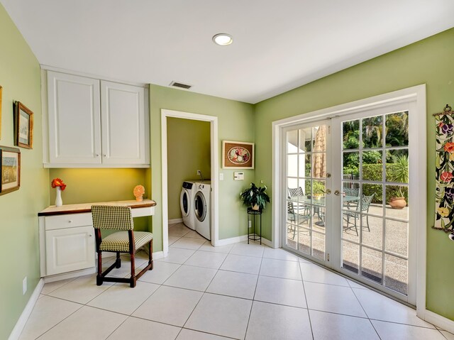 entryway with washing machine and dryer, light tile floors, and french doors