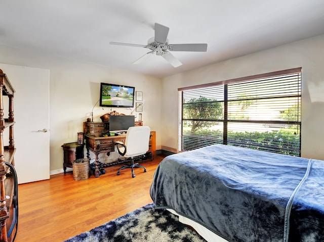 bedroom featuring light hardwood / wood-style floors and ceiling fan