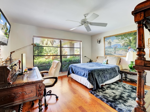 bedroom with light hardwood / wood-style floors and ceiling fan