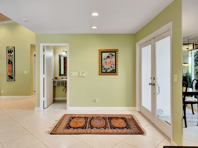 tiled entryway featuring french doors