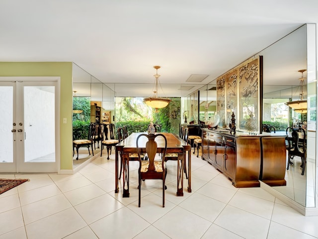 dining room featuring light tile floors, french doors, and a wealth of natural light