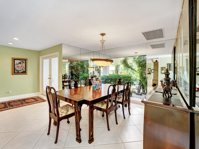 dining room with light tile floors and french doors