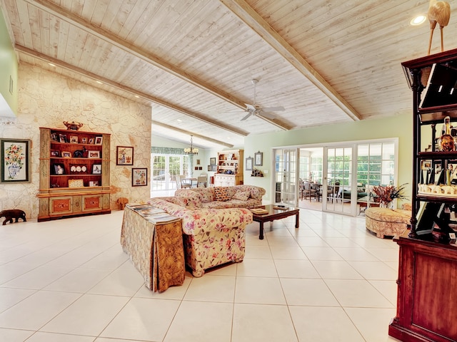 tiled living room featuring lofted ceiling with beams, wooden ceiling, and ceiling fan