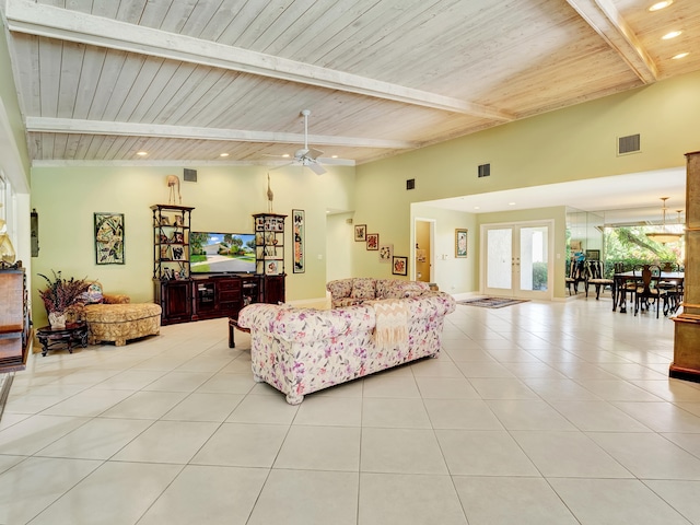 living room featuring ceiling fan with notable chandelier, wood ceiling, and beam ceiling