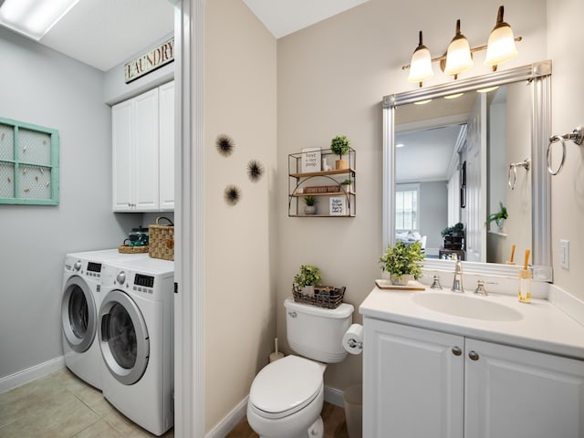 bathroom featuring vanity, tile patterned floors, washer and clothes dryer, and toilet