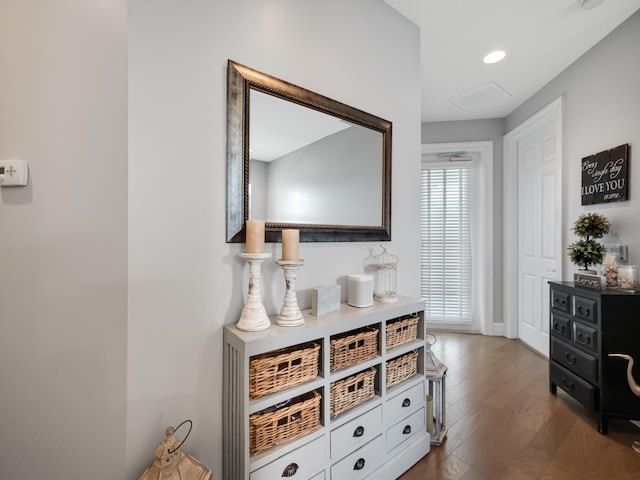 hallway with hardwood / wood-style flooring