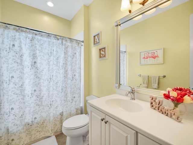 bathroom with vanity, a shower with shower curtain, toilet, and tile patterned flooring