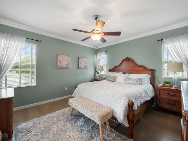 bedroom with dark wood-type flooring, ceiling fan, and crown molding