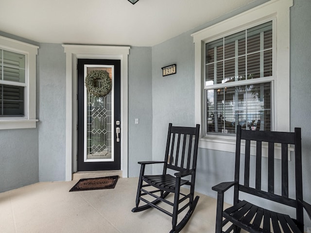 doorway to property featuring covered porch