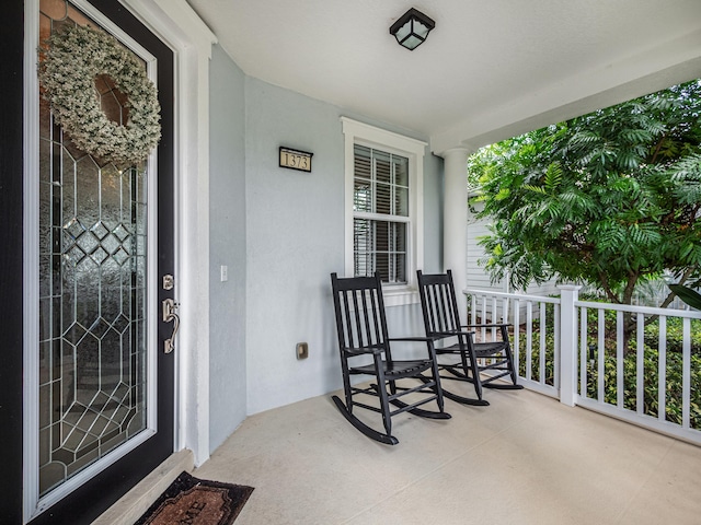 doorway to property featuring covered porch