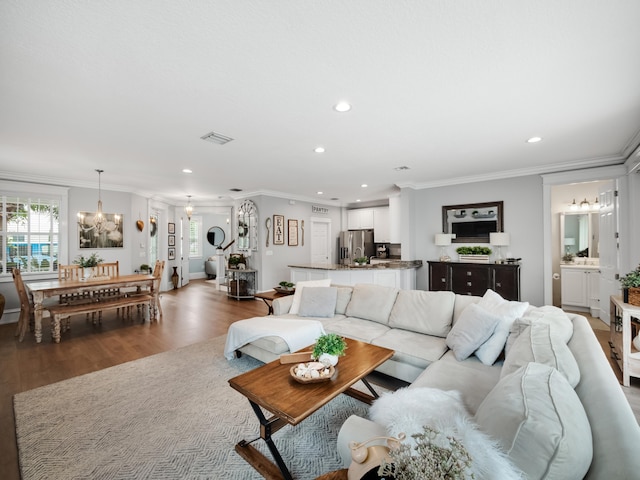 living room featuring crown molding and wood-type flooring