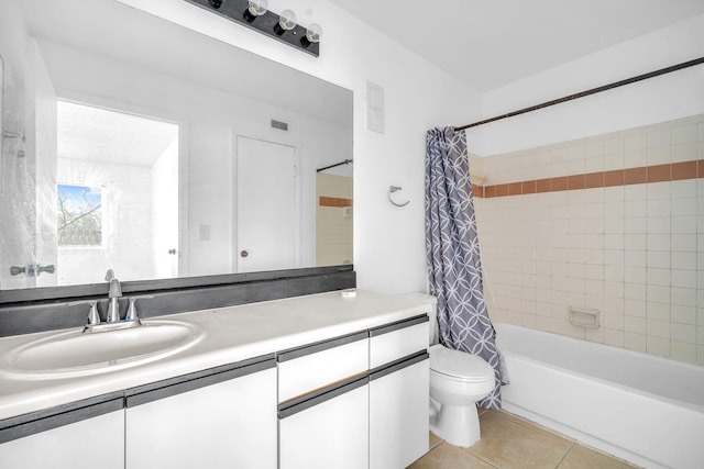 full bathroom featuring shower / bath combo, toilet, vanity, and tile floors