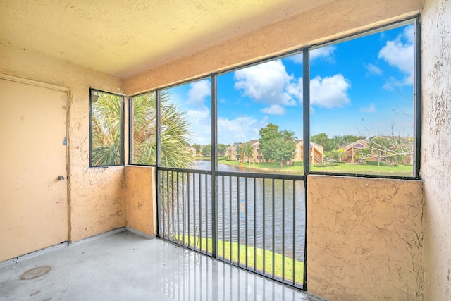 unfurnished sunroom featuring a wealth of natural light