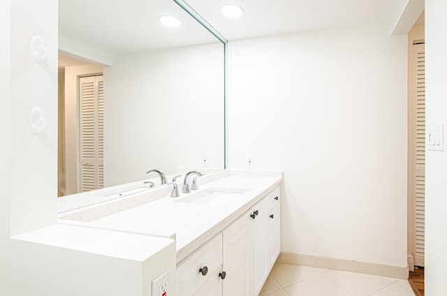 bathroom with vanity and tile patterned flooring