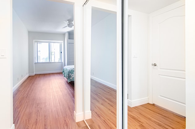 hall with light hardwood / wood-style floors