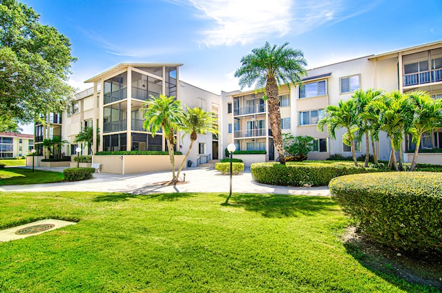 view of home's community featuring a lawn