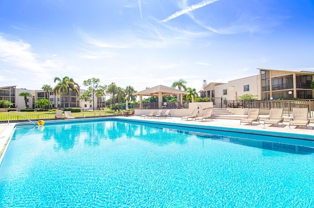 view of pool with a patio and a gazebo