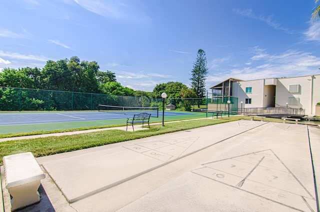 view of community with tennis court