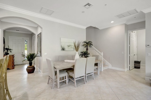 tiled dining space with ornamental molding