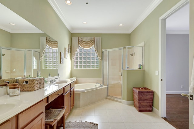 bathroom with shower with separate bathtub, ornamental molding, and tile floors