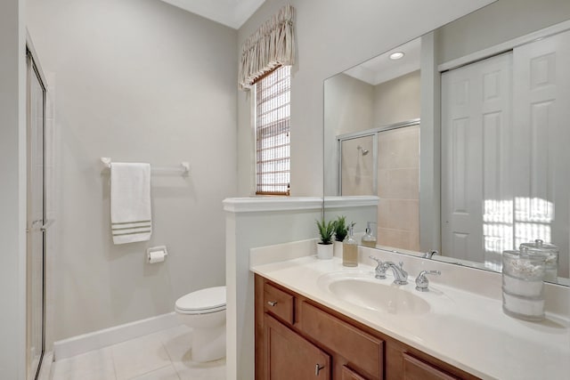 bathroom featuring toilet, tile flooring, an enclosed shower, and vanity