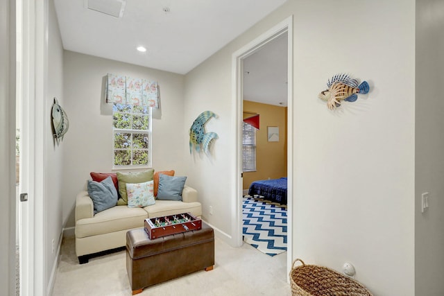 sitting room with light carpet