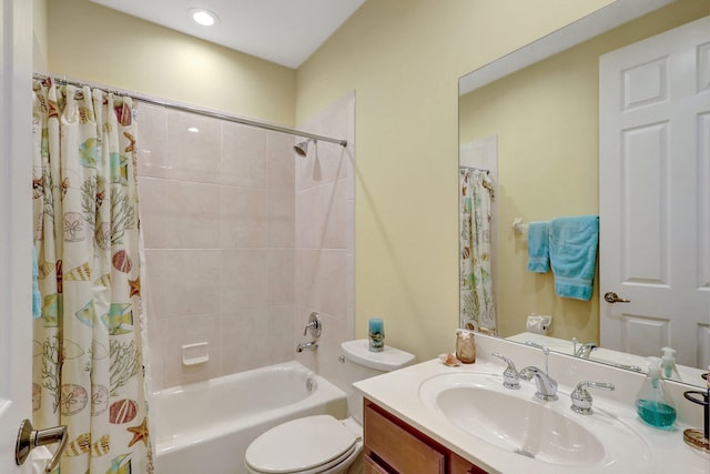 full bathroom with vanity, shower / tub combo with curtain, and toilet