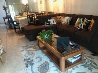 living room featuring light tile flooring