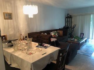 dining space with an inviting chandelier