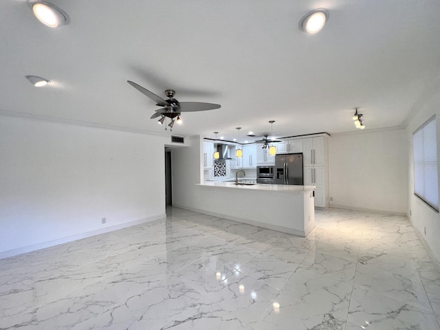 unfurnished living room featuring light tile flooring, ceiling fan, and sink