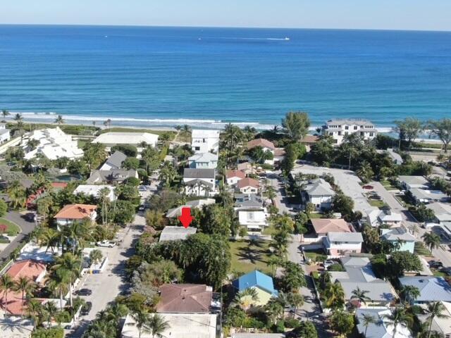 birds eye view of property featuring a water view