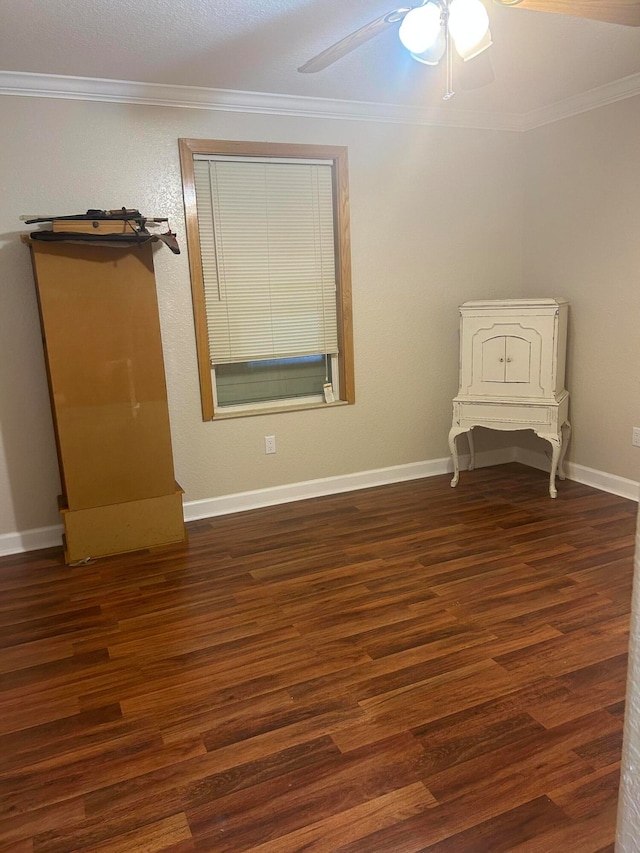 unfurnished bedroom with ceiling fan, dark hardwood / wood-style floors, and crown molding